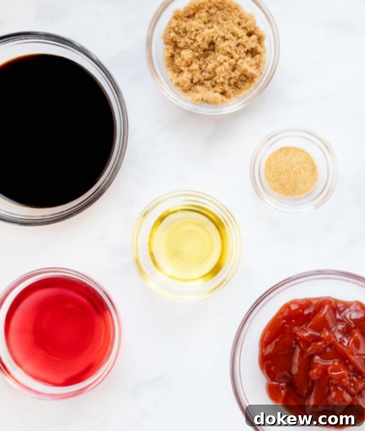 soy-garlic-beef-marinade-post-vert-min overhead shot of bowls with red wine vinegar, soy sauce, brown sugar, olive oil, garlic powder, and ketchup, ready to be combined for the marinade