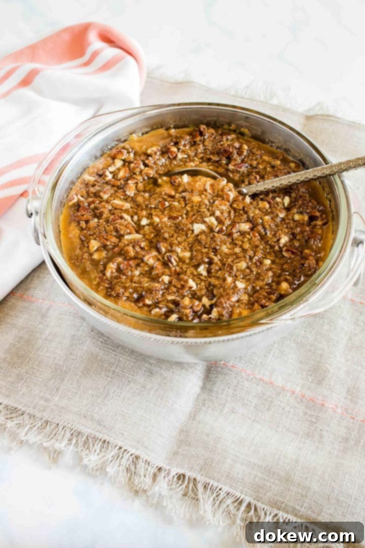 sweet-potato-casserole-post-min Sweet potato casserole with streusel topping, ready for serving at a holiday dinner