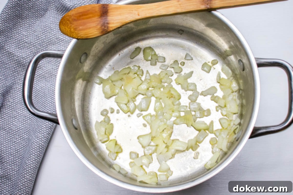 30 Minute Hash Brown Potato Soup Chopped onion sautéed in oil in a soup pot.