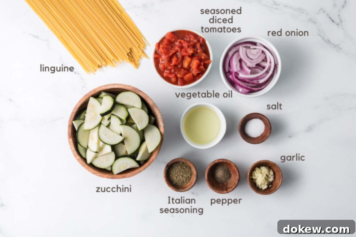 Fresh Zucchini Linguine 3 Ingredients for zucchini linguine in prep bowls, showcasing fresh vegetables and seasonings.