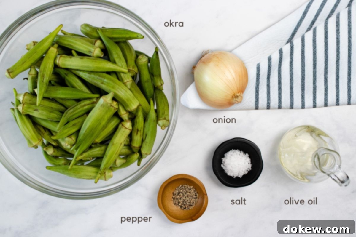 Effortless Sheet Pan Roasted Okra and Onions 3 Close-up of fresh, vibrant ingredients for Roasted Okra and Onions: bright green okra pods, a perfectly sliced yellow onion, a bottle of premium olive oil, and small bowls holding sea salt and freshly ground black pepper on a rustic wooden board, ready for preparation.
