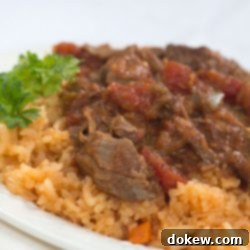 Slow Cooked Cuban Shredded Beef 3 Ropa Vieja stew on a bed of rice