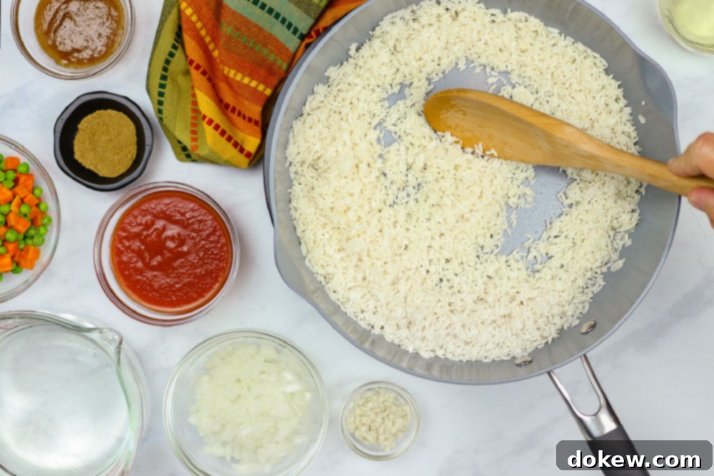 Fiesta Rice with Fresh Vegetables 4 Rice in a skillet with ingredients for Restaurant Style Mexican Rice next to it