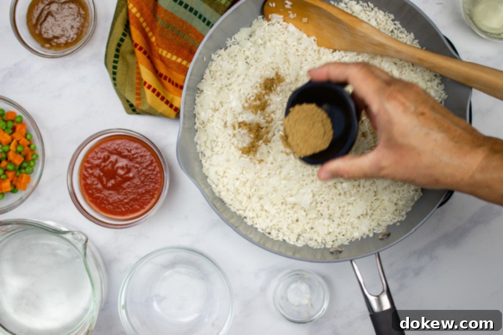 Fiesta Rice with Fresh Vegetables 5 Diced onions, cumin, and rice in a skillet with ingredients for Restaurant Style Mexican Rice next to it