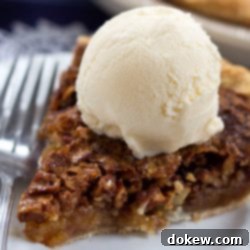 Classic Homemade Pecan Pie 3 Homemade pecan pie topped with a scoop of vanilla ice cream