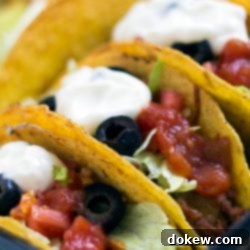 30-Minute Oven-Baked Beef Tacos 3 Hard-shell tacos with beef, lettuce, olives, salsa, and sour cream
