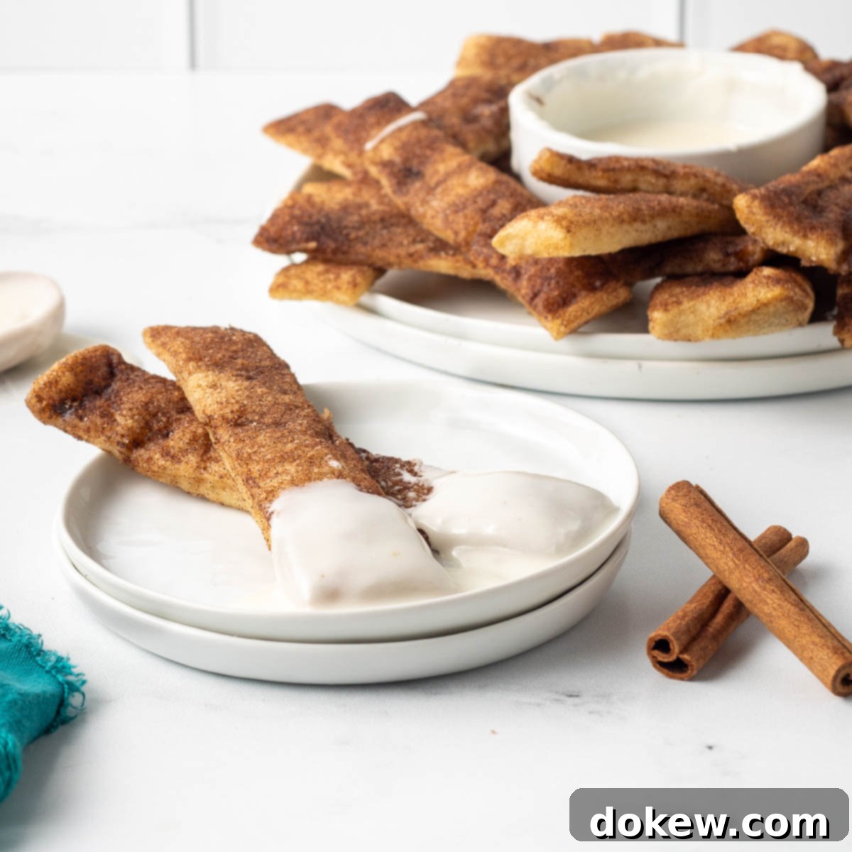 Quick Pizza Dough Cinnamon Twists 11 Baked cinnamon sticks encrusted with cinnamon sugar and served alongside a bowl of creamy vanilla icing for dipping.