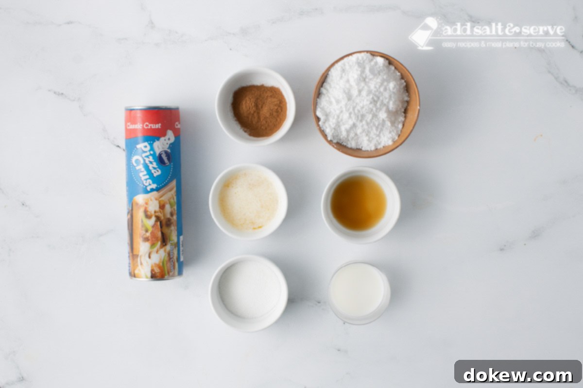 Quick Pizza Dough Cinnamon Twists 3 A flat lay showing all the simple ingredients needed for homemade cinnamon sticks: a roll of pizza dough, ground cinnamon, granulated sugar, melted butter, powdered sugar, vanilla extract, and milk.