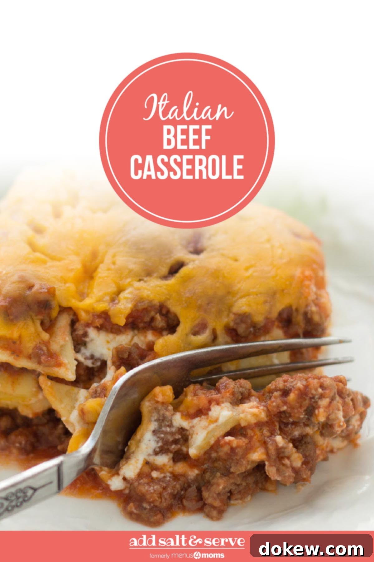 Zesty Layered Italian Beef Bake 4 A slice of Layered Italian Beef Casserole being cut by a fork, ready to be served from a large baking dish