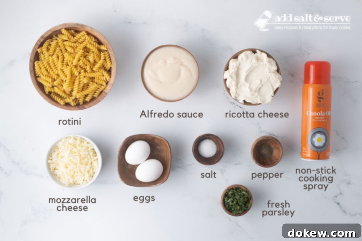 Golden Baked Alfredo Rotini 3 Ingredients for Rotini Pasta Bake: rotini, Alfredo sauce, ricotta cheese, mozzarella cheese, eggs, salt, pepper, fresh parsley, and non-stick cooking spray.