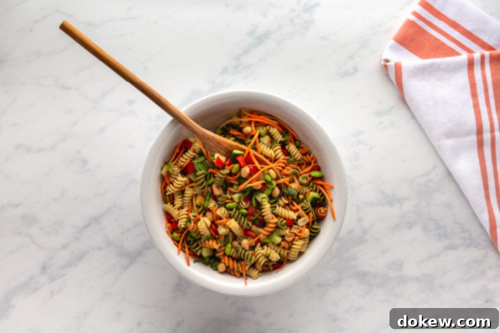 Thai Sesame Noodle Bowl 7 mixing Thai Pasta Salad with Sesame-Ginger Dressing