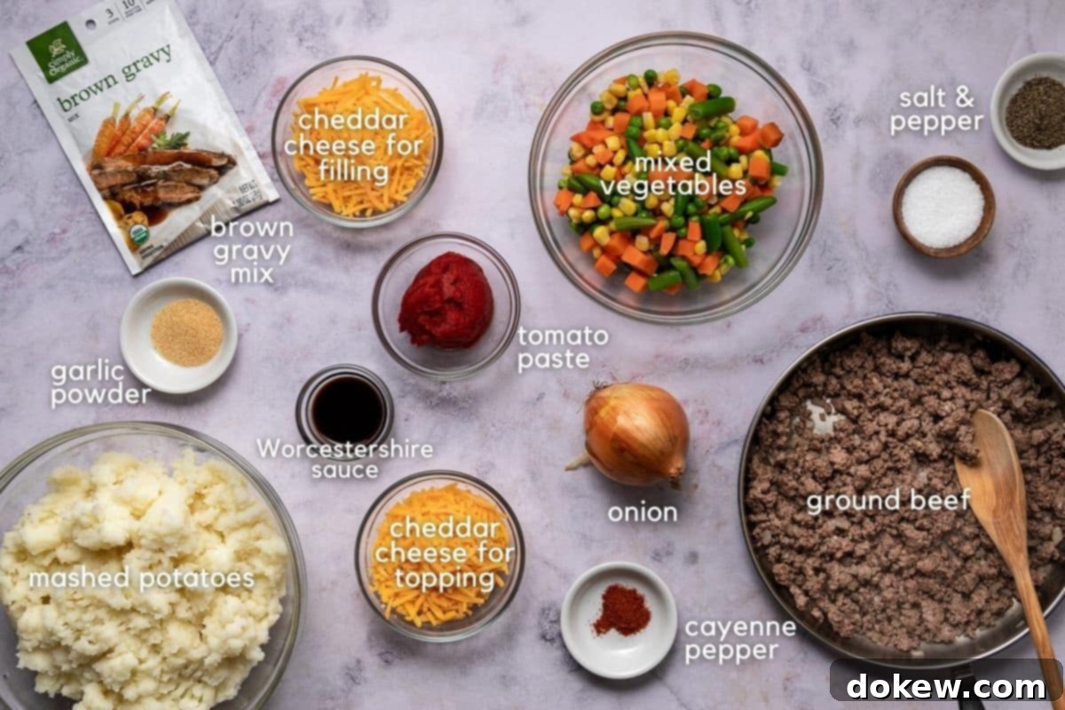 Effortless Make-Ahead Shepherd's Pie 3 Ingredients for SHepherd's Pie: ground beef, onion, cayenne pepper, tomato paste, cheddar cheese, Worcestershire sauce, garlic powder, brown gravy mix, mashed potatoes, salt, and pepper.