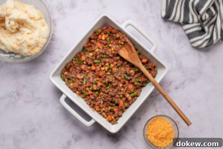 Effortless Make-Ahead Shepherd's Pie 7 beef and vegetable mixture for shepherd's pie in a baking pan