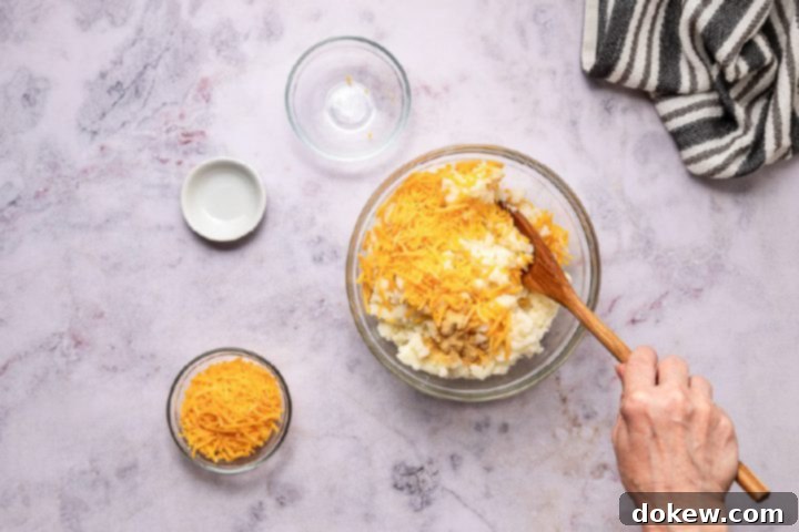 Effortless Make-Ahead Shepherd's Pie 8 mixing cheese into mashed potatoes
