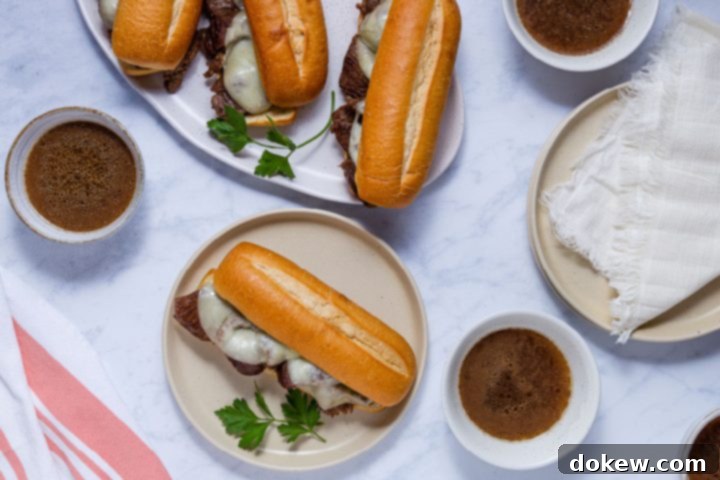 Ultimate Instant Pot French Dip with French Onion Soup 2 French dip sandwiches with au jus