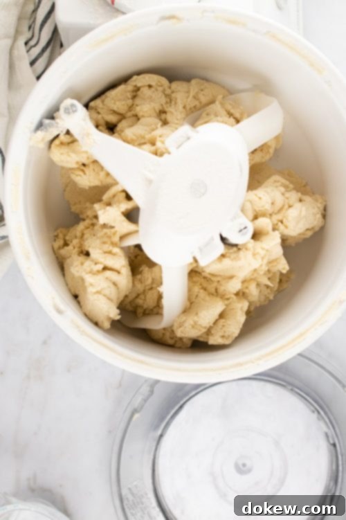 Make-Ahead Buttery Flaky Pie Crust 9 Overhead shot of pie crust dough in a mixer