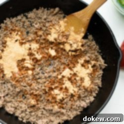 Fiesta Taco Blend 2 Homemade taco seasoning mix ready to be used on ground beef, showcasing a vibrant blend of spices.