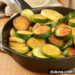Golden Sautéed Zucchini and Summer Squash 2 Sautéed yellow squash and zucchini in a cast iron skillet.