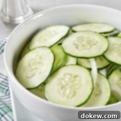 Pickled Cucumber Salad 2 Cucumber and onion salad in a bowl.