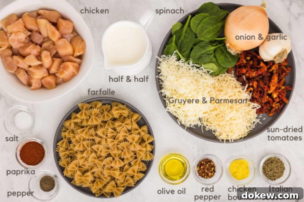 Tuscan Sunset Chicken 3 A beautiful array of fresh ingredients for Creamy Tuscan Chicken, including cubed chicken breasts, rich cream, fresh spinach, aromatic yellow onion, pungent garlic, shredded Gruyere and Parmesan cheeses, tangy sun-dried tomatoes, fragrant Italian seasoning, chicken bouillon, a hint of red pepper flakes, olive oil, mini farfalle pasta, paprika, and perfectly seasoned with pepper and salt. All laid out on a rustic wooden surface, ready for cooking.