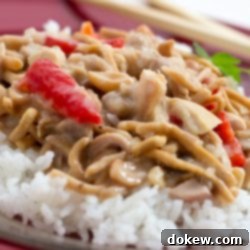 Sandys Quick and Delicious Cashew Chicken 2 Chopped chicken with red peppers and mushrooms in a creamy sauce over white rice and garnished with chow mein noodles