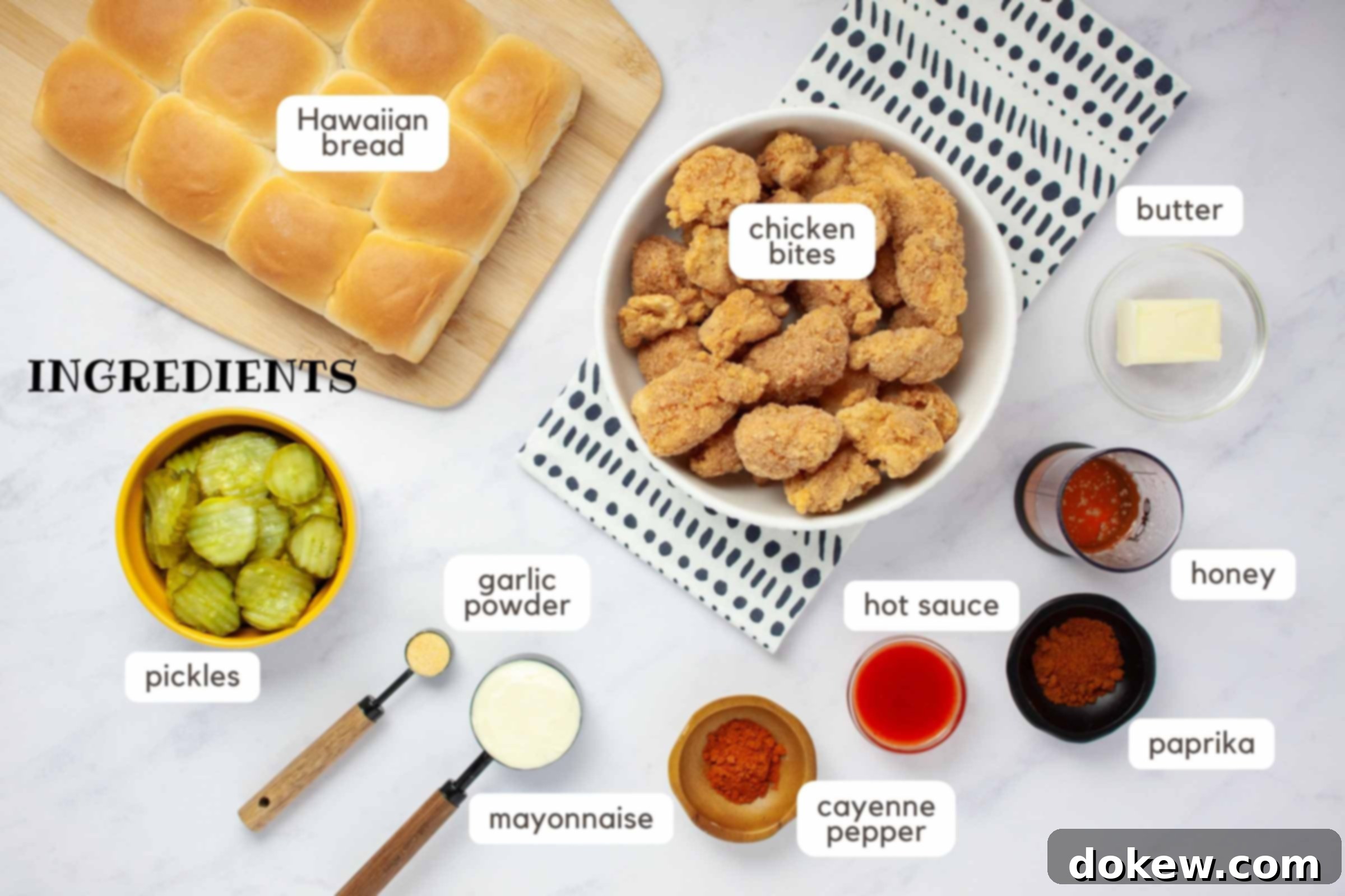 Sweet Heat Sliders: Done in a Flash 3 Ingredients on a counter: Frozen chicken bites, butter, honey, paprika, hot sauce, cayenne pepper, mayonnaise, garlic powder, pickles, and Hawaiian bread.