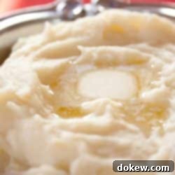 Ultimate Celebration Mash 2 Mashed Potatoes with a pat of melting butter.