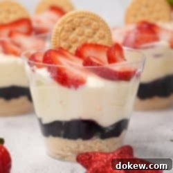 Patriotic Parfaits 6 Red, white, and blue parfaits in plastic cups topped with sliced strawberries and a sandwich cookie.