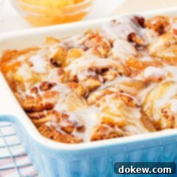 Simple Two-Ingredient Apple Cinnamon Delight 8 Apple cinnamon roll bake in pan with glaze on top.