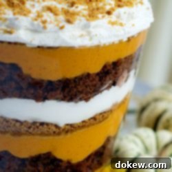 Decadent Pumpkin Trifle 2 Image of layers of pumpkin filling, crushed gingersnaps, crumbled gingerbread, and whipped cream in a trifle bowl