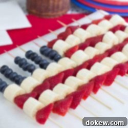 Red, White, and Blue Fruit Delights 3 Blueberries, strawberries, and bananas threaded on bamboo skewers in the design of an American flag