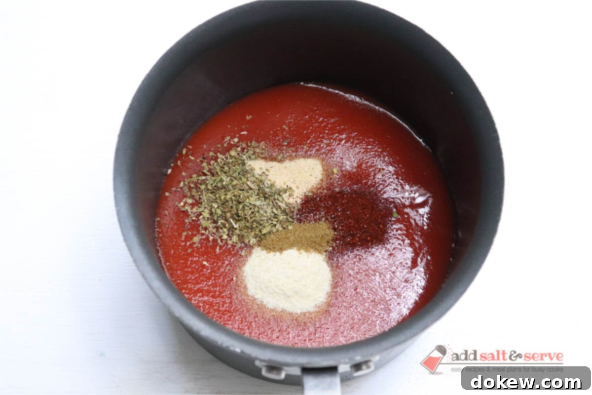 Ingredients for homemade mojado sauce in a saucepan before mixing and heating.