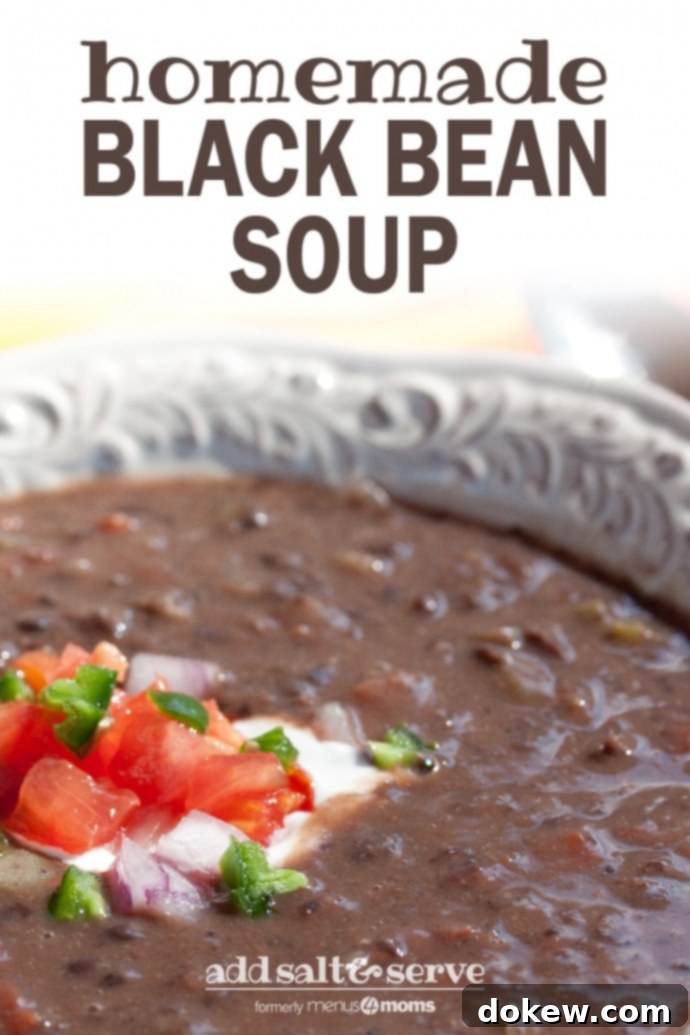 Homemade black bean soup A white shallow bowl with Black Bean Soup garnished with sour cream, diced tomatoes, diced red onion, and fresh cilantro and text Black Bean Soup add salt & serve formerly Menus4Moms
