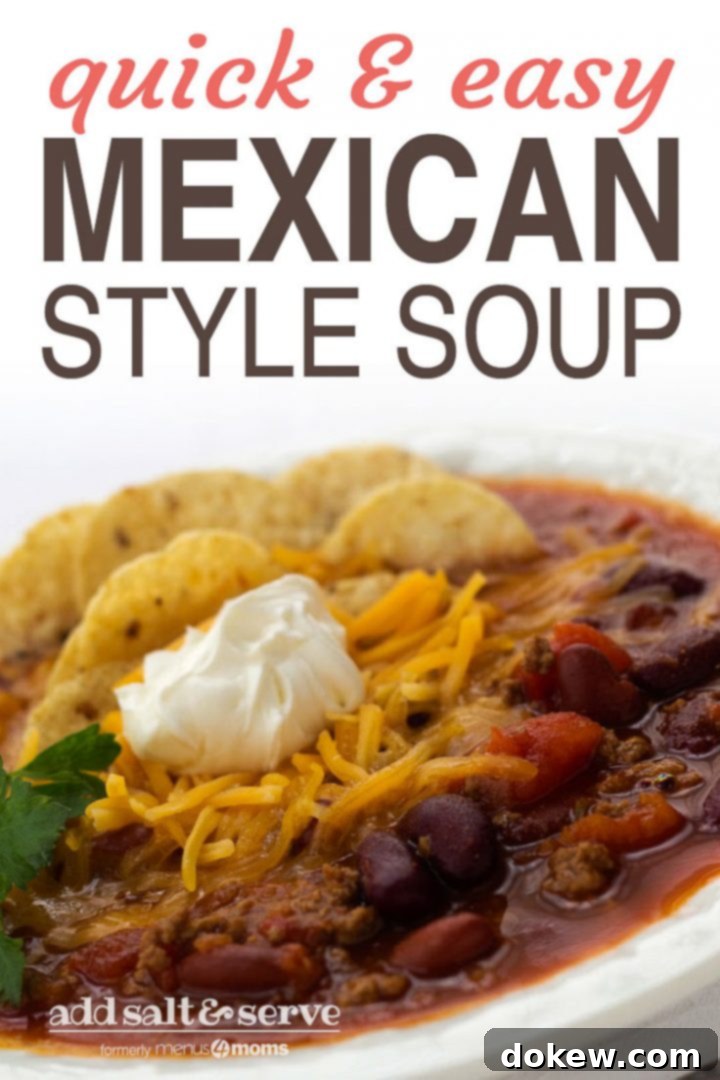 Quick & Easy Mexican Style Soup Pin A Pinterest-optimized image showcasing a white bowl filled with vibrant Mexican beef and bean soup, garnished with shredded cheddar cheese, tortilla chips, sour cream, and fresh cilantro. Text overlay reads 'Quick & Easy Mexican Style Soup - Add Salt & Serve' with hashtags #kidfriendlyfood #quickandeasymeals #weeknightdinners #menus4moms #addsaltandserve