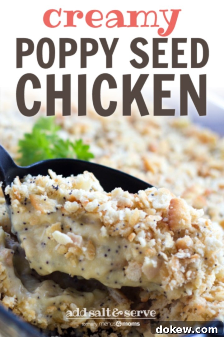Poppy Seed Chicken Casserole A black spoon is scooping golden-brown Poppy Seed Chicken Casserole from a clear glass casserole dish, highlighting the creamy chicken and crunchy Ritz cracker topping.
