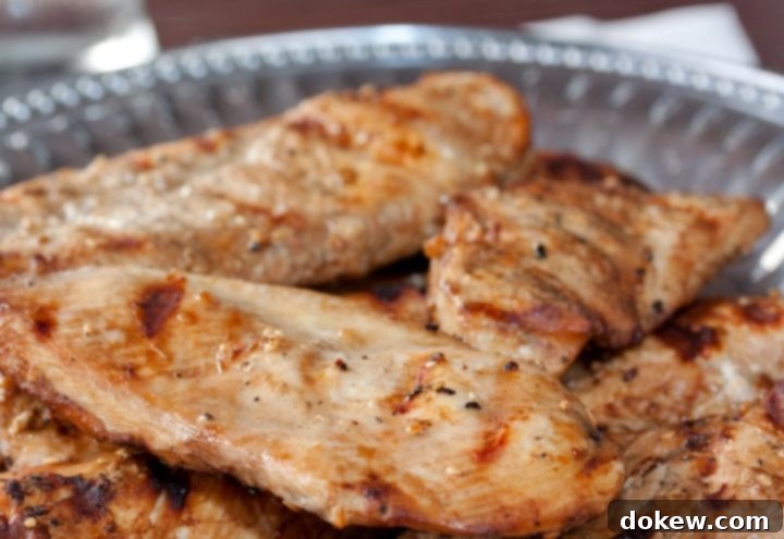 Grilled Sesame Chicken Grilled boneless skinless chicken breasts with a sesame marinade brushed on them and served on a Armetale platter