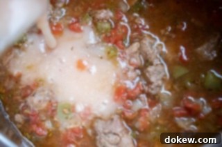 Thickened Carne Guisada Gravy in Instant Pot Carne Guisada in the Instant Pot with a rich, thickened gravy coating the tender beef and vegetables, after the flour slurry has been fully incorporated and simmered.