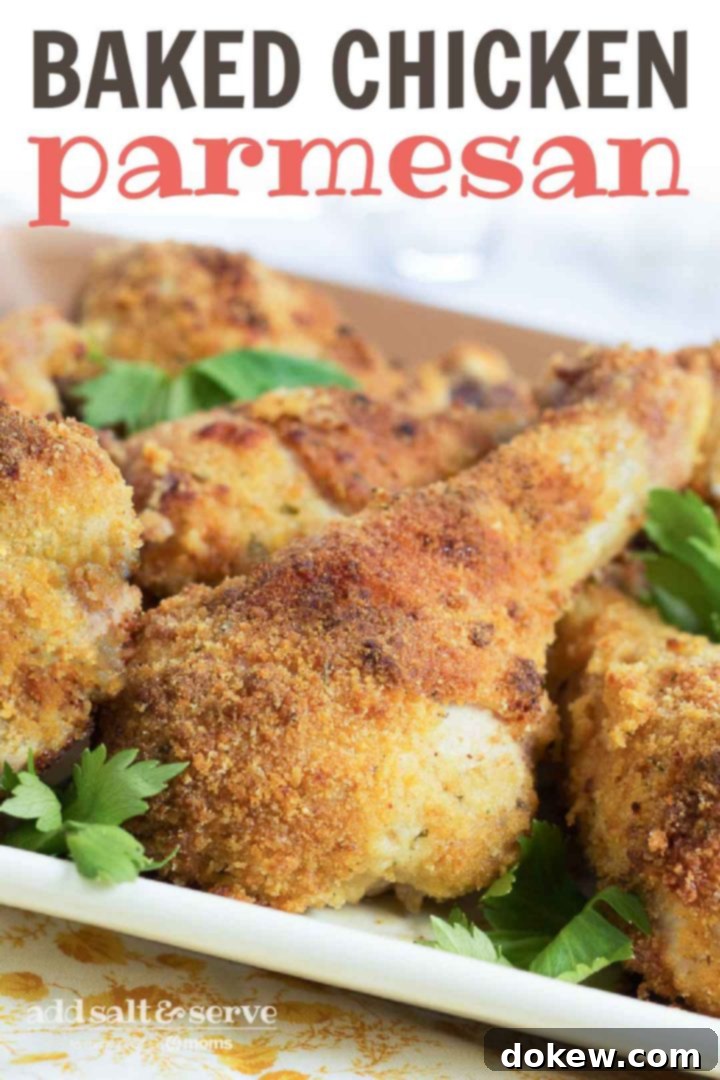 Baked Chicken Parmesan Drumsticks with Parsley Two perfectly baked, breaded chicken parmesan drumsticks, garnished with green parsley