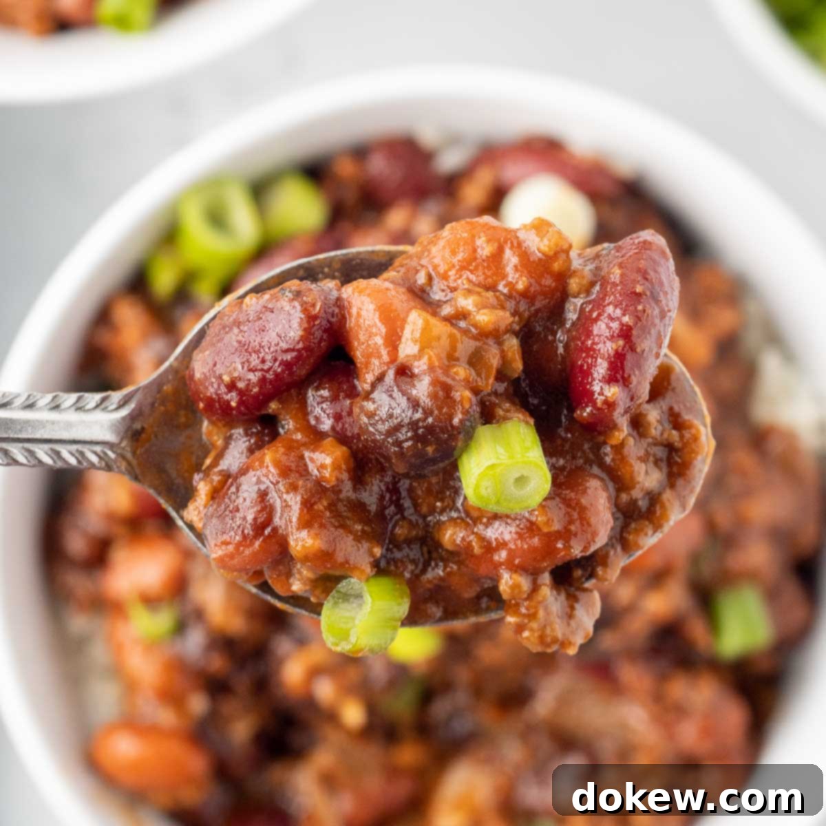 30-Minute BBQ Beef and Beans 2 Spoonful of BBQ Beans with Ground Beef garnished with fresh green onions