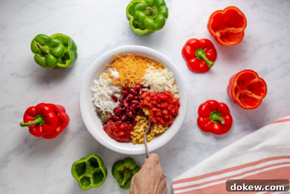 Easy Cheesy Southwestern Stuffed Peppers 4 All the combined ingredients for the Southwestern Stuffed Pepper filling in a large mixing bowl, ready to be scooped into bell peppers.