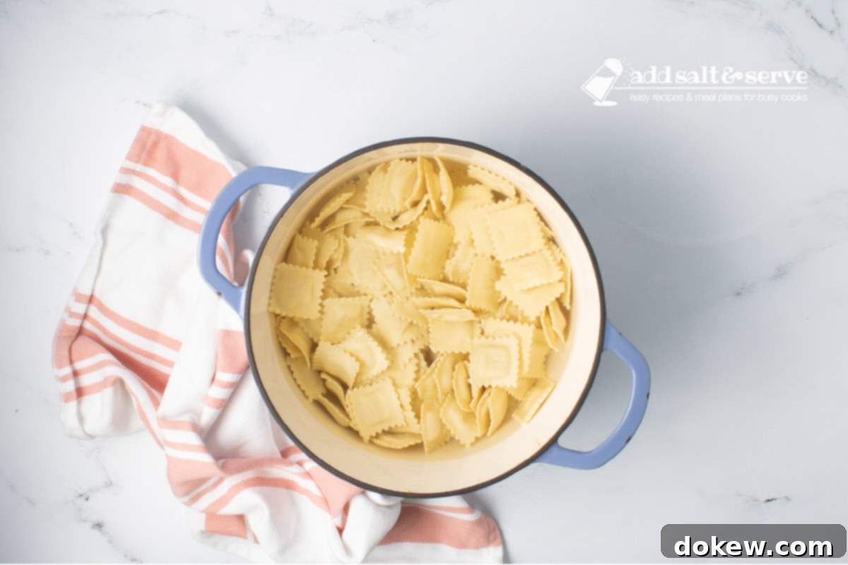 Velvety 20-Minute Summer Squash Ravioli 4 Dutch oven of cheese ravioli in water.