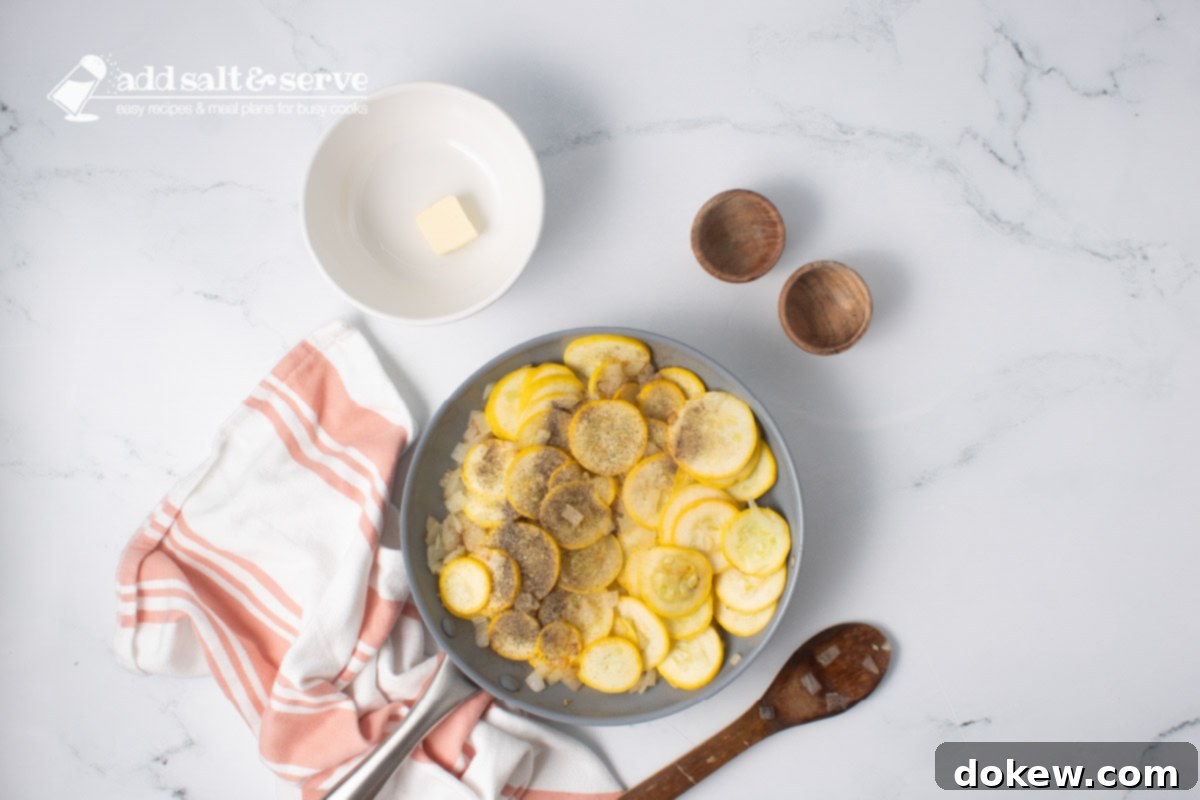 Velvety 20-Minute Summer Squash Ravioli 6 Yellow squash, chopped onion, salt, and pepper in a skillet with a wooden spoon and a bowl with a pat of butter.