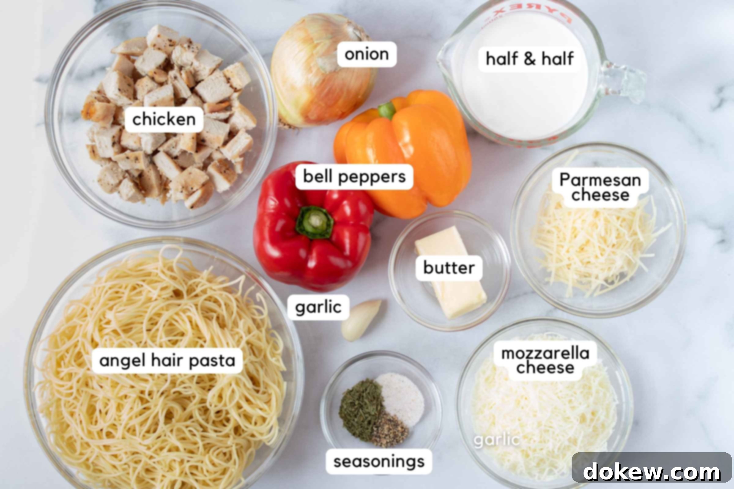 Chicken Pepper Pasta Ingredients: cooked chicken, onion, red bell pepper, yellow bell pepper, half and half, butter, garlic, shredded Parmesan cheese. shredded mozzarella cheese, cooked angel hair pasta, and small bowl with tarragon, pepper, and salt.